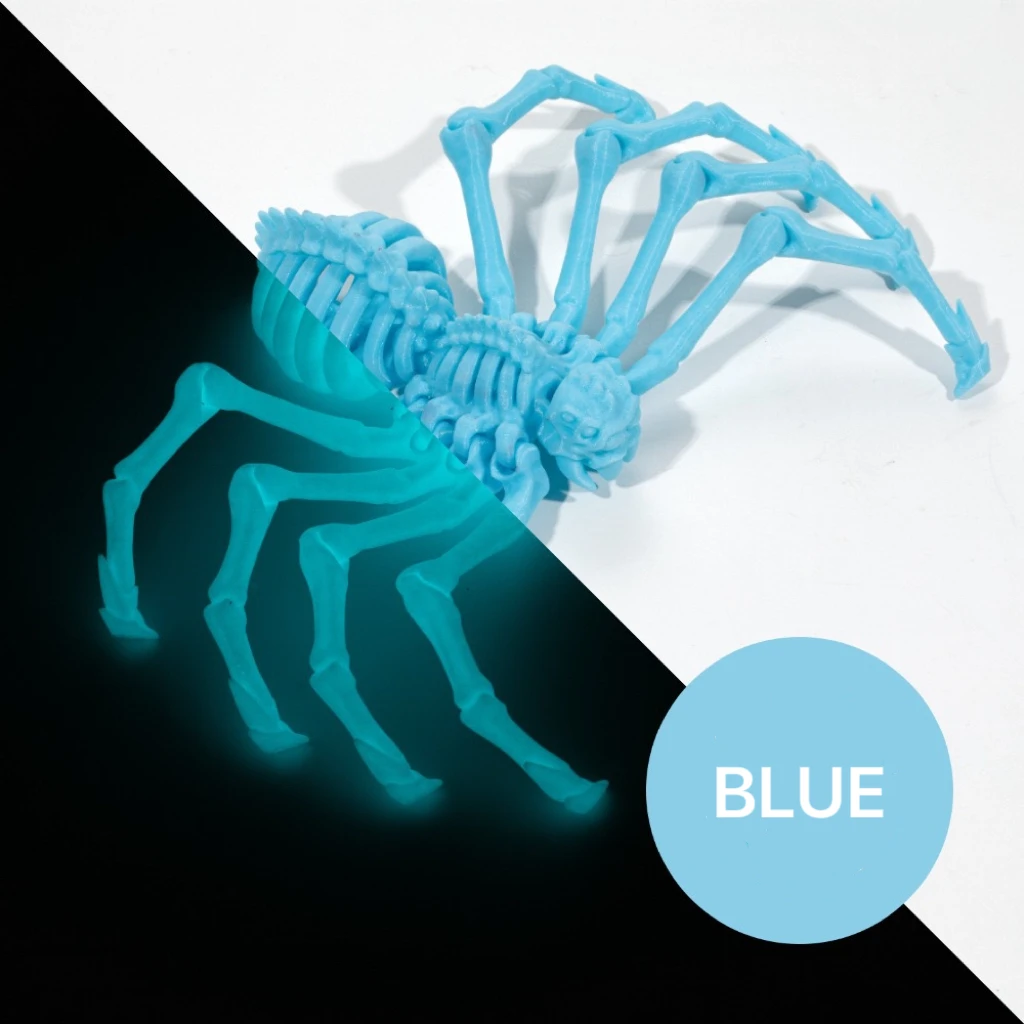 Large spider in blue, shown in daylight and with a glow effect.