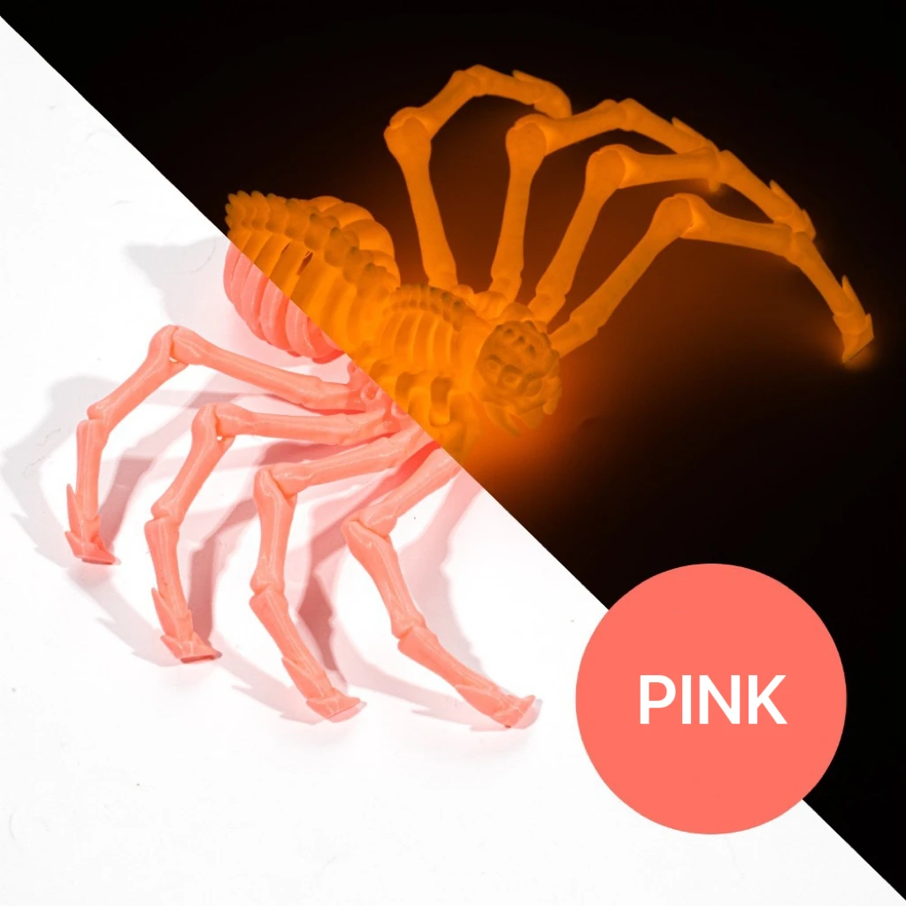 Large spider in pink, shown in daylight and with a glow effect.